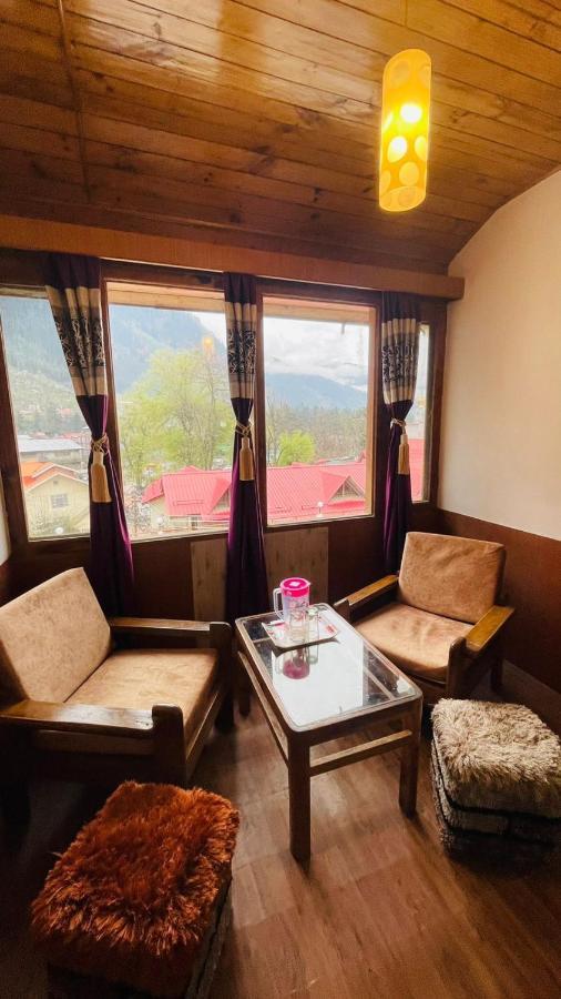 Hotel New Hilltop Inn Manāli Екстериор снимка